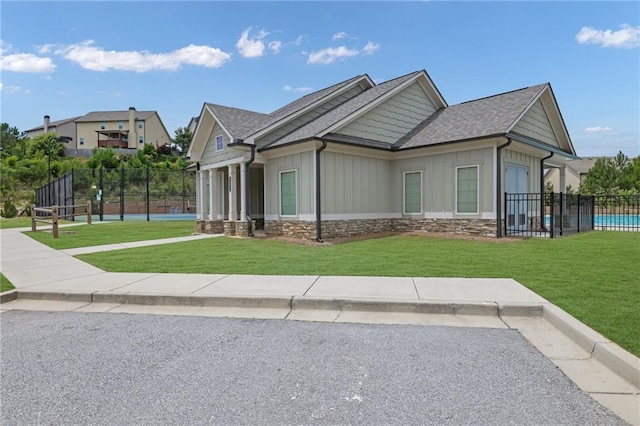 1267 Castleberry Dr, Buford, GA 30518 - view of property exterior with board and batten siding and a shingled roof