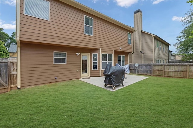 1267 Castleberry Dr, Buford, GA 30518 - back of property featuring a patio and a chimney