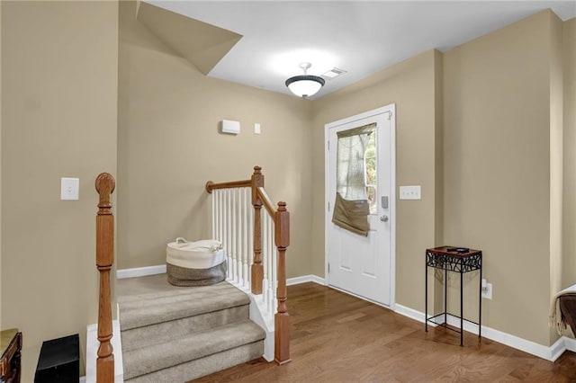 1267 Castleberry Dr, Buford, GA 30518 - entrance foyer with baseboards, wood finished floors, and stairway