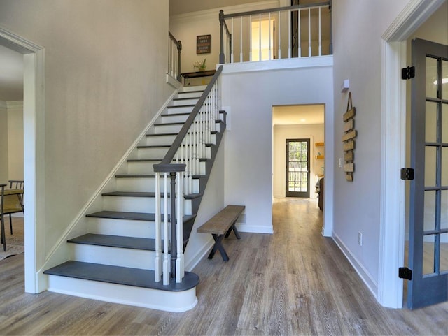 staircase featuring hardwood / wood-style flooring