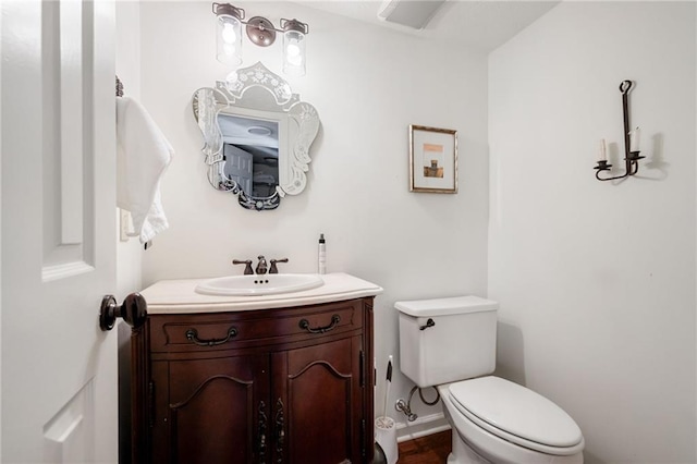 bathroom with vanity and toilet