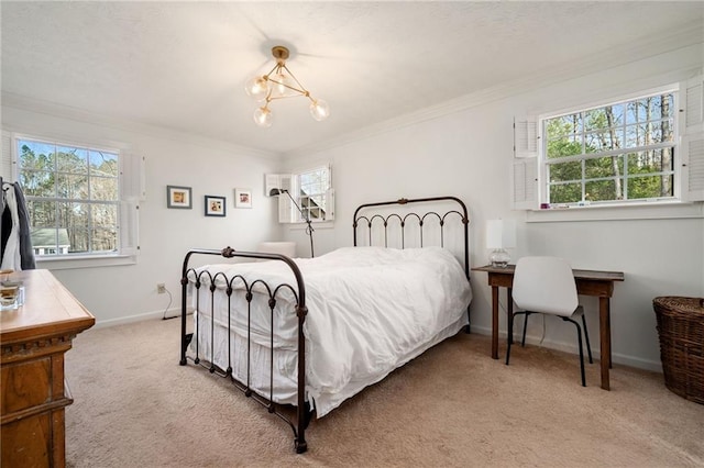 carpeted bedroom with multiple windows and ornamental molding