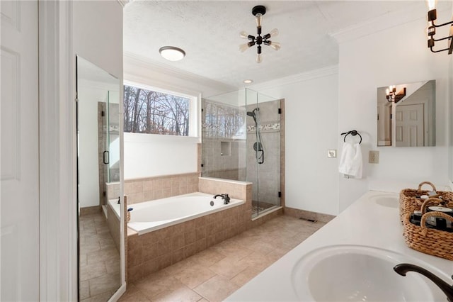 bathroom with vanity, crown molding, and plus walk in shower