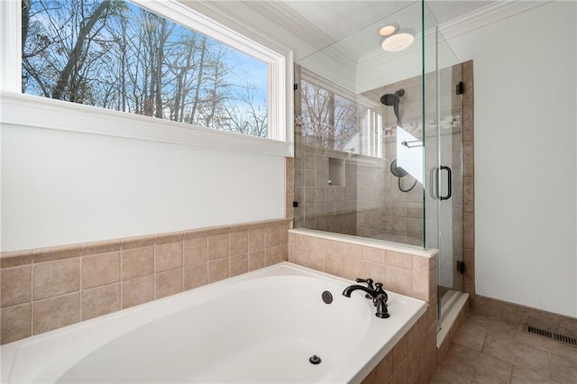 bathroom with tile patterned floors, ornamental molding, and independent shower and bath