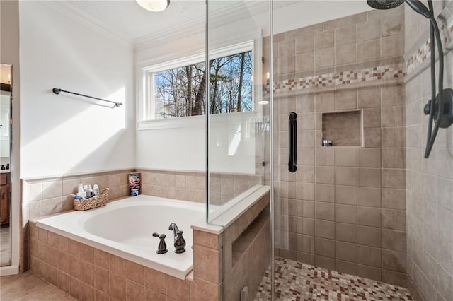 bathroom with vanity, tile patterned flooring, crown molding, and plus walk in shower