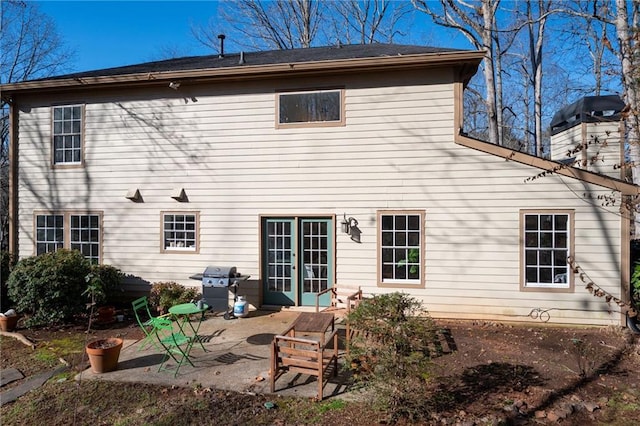 rear view of property featuring a patio area