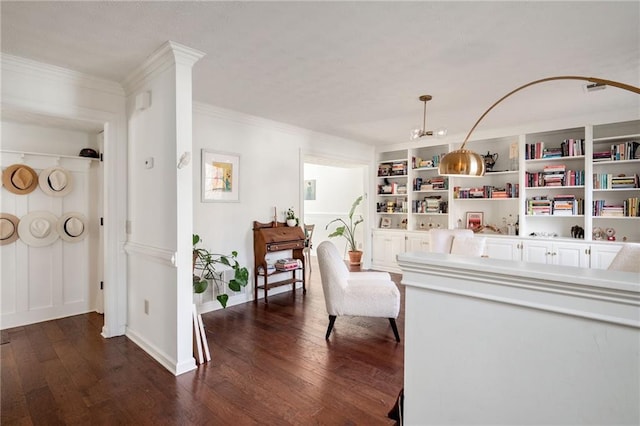 interior space featuring built in shelves, dark wood-type flooring, and ornamental molding