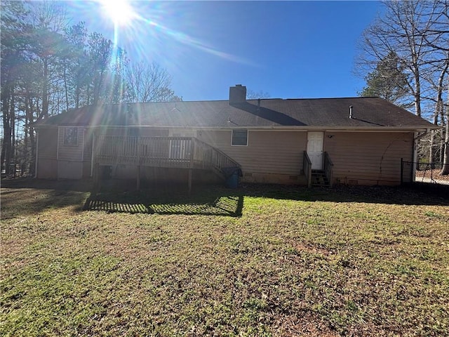 440 Ward Rd, Ellenwood, GA 30294 - back of property with crawl space, a chimney, a deck, and entry steps