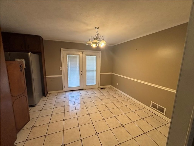 440 Ward Rd, Ellenwood, GA 30294 - unfurnished dining area with a chandelier, ornamental molding, french doors, baseboards, and light tile patterned flooring