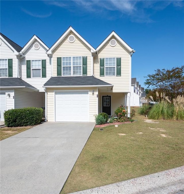 view of front facade with a garage and a front lawn