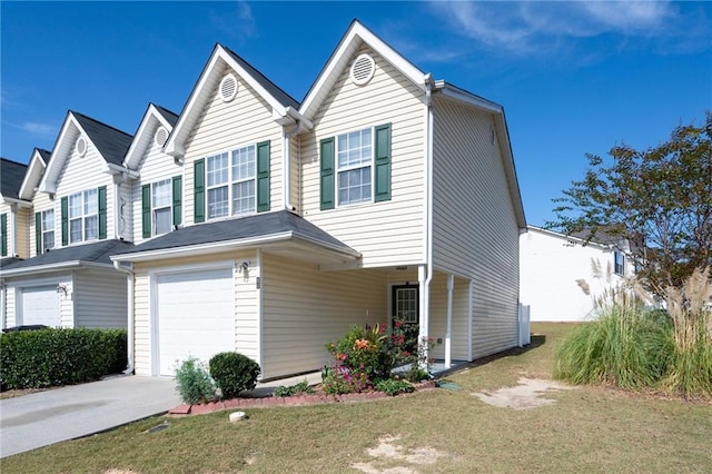 view of front facade featuring a front yard and a garage