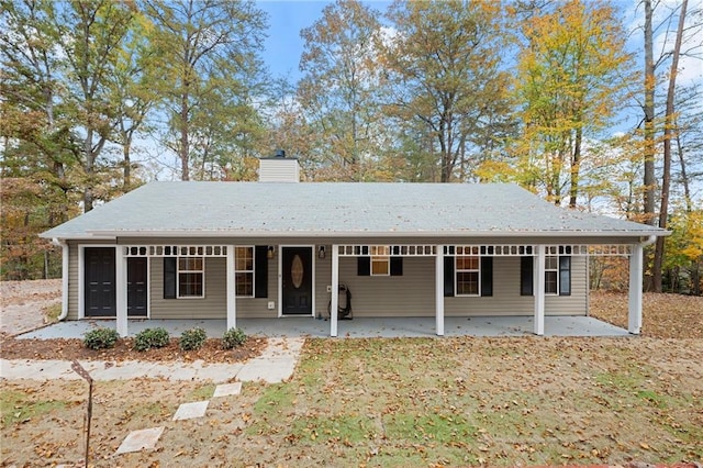 view of front of house featuring covered porch and a garage