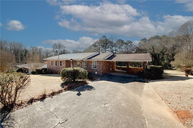 single story home featuring a carport