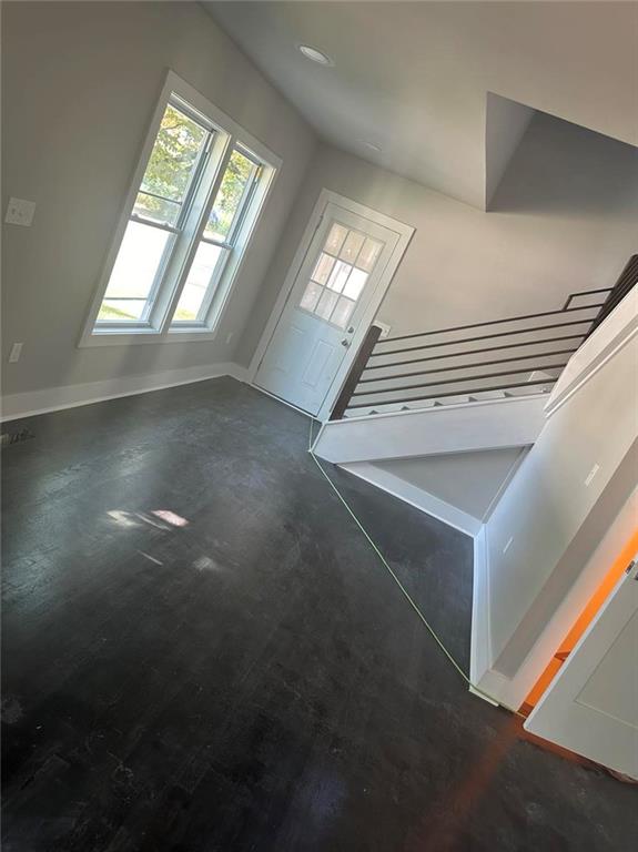 stairway with concrete flooring