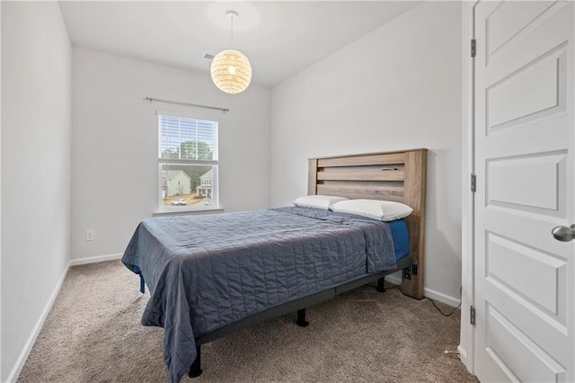 carpeted bedroom with baseboards