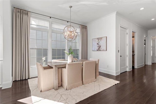 dining space with wood finished floors, baseboards, an inviting chandelier, recessed lighting, and crown molding