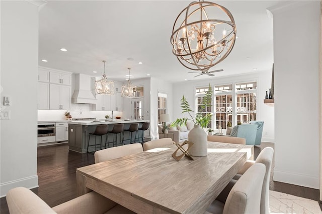 dining area featuring recessed lighting, dark wood-style flooring, and baseboards