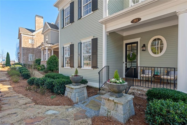 property entrance featuring covered porch