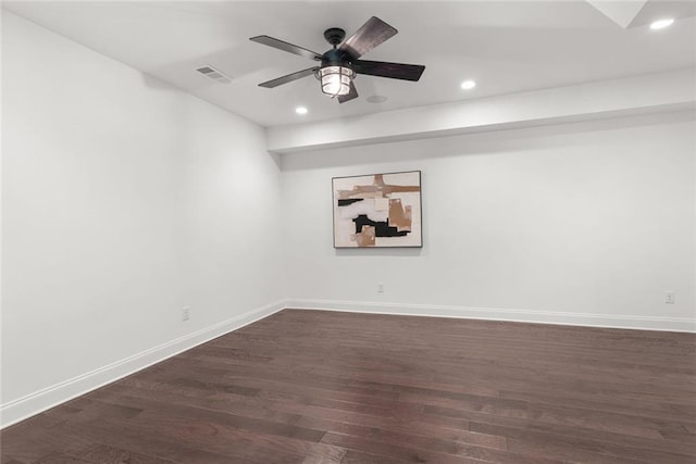 spare room featuring visible vents, dark wood-type flooring, baseboards, recessed lighting, and a ceiling fan