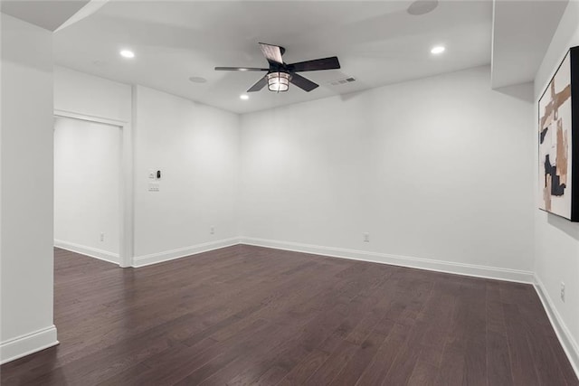 spare room featuring visible vents, baseboards, dark wood finished floors, recessed lighting, and a ceiling fan