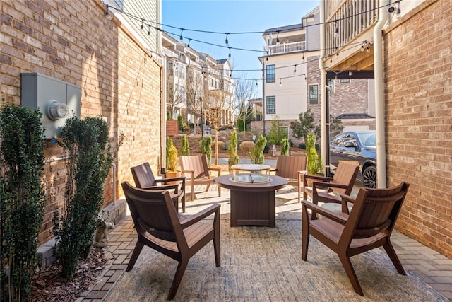 view of patio with an outdoor fire pit