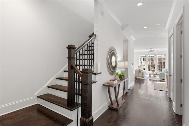 stairs with baseboards, recessed lighting, ceiling fan, ornamental molding, and wood-type flooring