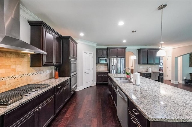 265 Enfield Ln, Mcdonough, GA 30252 - kitchen with wall chimney range hood, appliances with stainless steel finishes, a sink, ornamental molding, and a large island with sink
