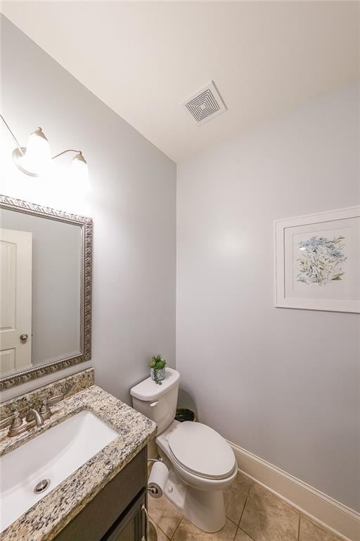 265 Enfield Ln, Mcdonough, GA 30252 - bathroom with vanity, toilet, tile patterned floors, and baseboards