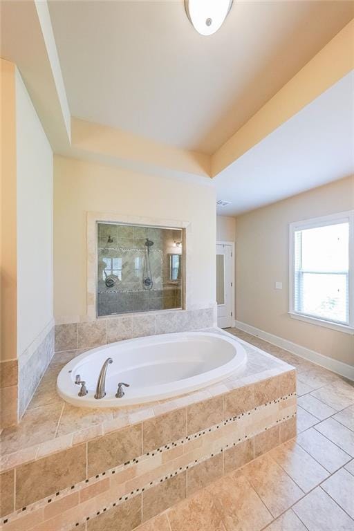 265 Enfield Ln, Mcdonough, GA 30252 - full bathroom with a bath, tile patterned flooring, and a tile shower