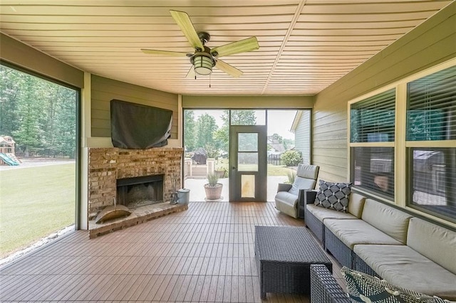 265 Enfield Ln, Mcdonough, GA 30252 - sunroom with an outdoor living space with a fireplace and ceiling fan