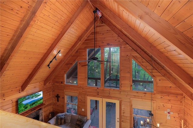 2374 Woodring Branch Rd, Chatsworth, GA 30705 - detailed view of wooden ceiling with exposed beams, wood walls, french doors, and rail lighting