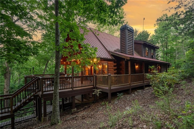 2374 Woodring Branch Rd, Chatsworth, GA 30705 - back of house featuring log siding, a chimney, a deck, stairway, and metal roof