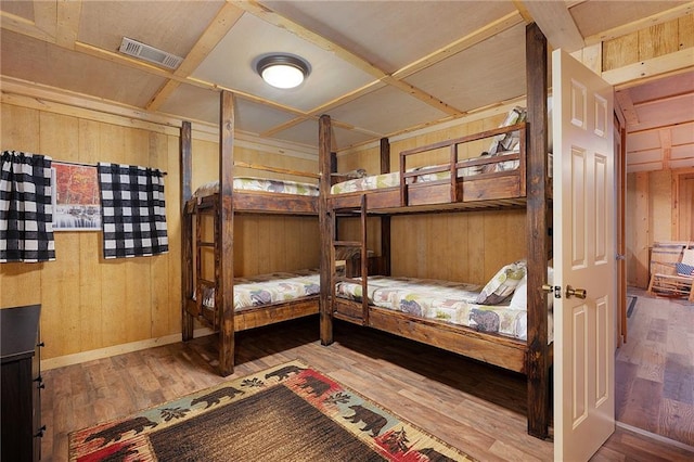 2374 Woodring Branch Rd, Chatsworth, GA 30705 - bedroom featuring wooden walls, hardwood / wood-style floors, and baseboards