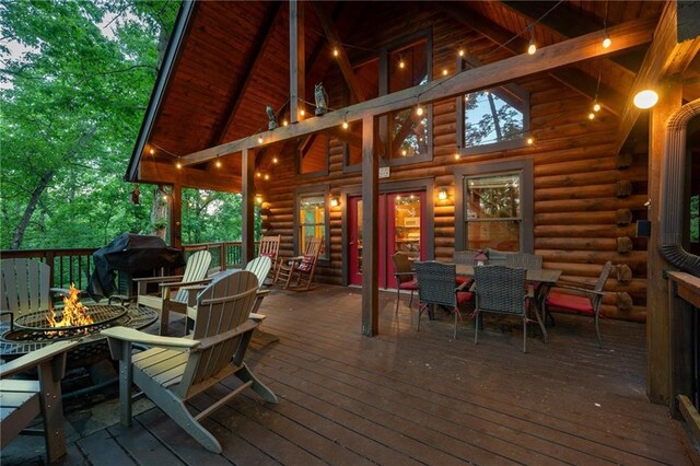2374 Woodring Branch Rd, Chatsworth, GA 30705 - deck featuring a fire pit, area for grilling, and outdoor dining space