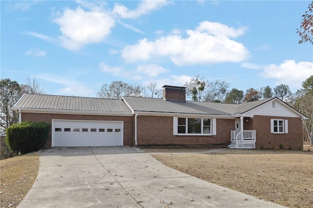 ranch-style home featuring a garage