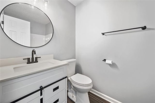 3232 Valley View St, Powder Springs, GA 30127 - bathroom with vanity, a textured ceiling, and wood finished floors