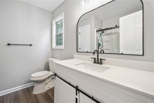 3232 Valley View St, Powder Springs, GA 30127 - bathroom with a stall shower, wood finished floors, and vanity