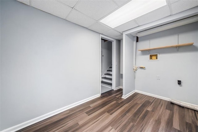 3232 Valley View St, Powder Springs, GA 30127 - finished below grade area featuring dark wood finished floors, a paneled ceiling, and stairs