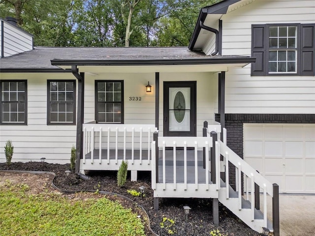 3232 Valley View St, Powder Springs, GA 30127 - entrance to property featuring a porch, an attached garage, and brick siding