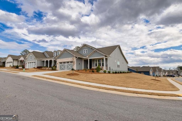 123 Rabun Ct, Hoschton, GA 30548 - craftsman-style home with a residential view, concrete driveway, and an attached garage