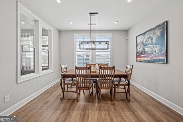 123 Rabun Ct, Hoschton, GA 30548 - dining room featuring wood finished floors and recessed lighting