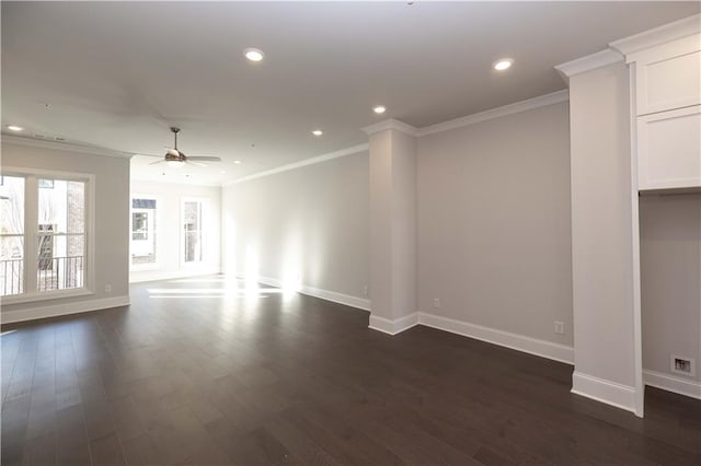 empty room featuring ceiling fan, dark hardwood / wood-style flooring, and ornamental molding