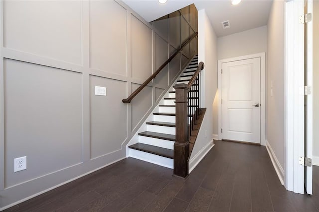 stairs with hardwood / wood-style flooring