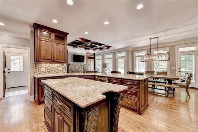 10020 Normandy Ln, Suwanee, GA 30024 - kitchen with ornamental molding, recessed lighting, a peninsula, a kitchen island, and light wood finished floors