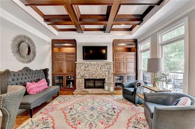 10020 Normandy Ln, Suwanee, GA 30024 - living area featuring coffered ceiling, beam ceiling, wood finished floors, ornamental molding, and a stone fireplace