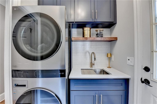 10020 Normandy Ln, Suwanee, GA 30024 - washroom with stacked washer / drying machine, cabinet space, and bar with sink
