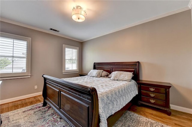 10020 Normandy Ln, Suwanee, GA 30024 - bedroom with light wood-style flooring and crown molding