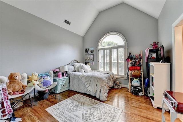 10020 Normandy Ln, Suwanee, GA 30024 - bedroom featuring vaulted ceiling and wood finished floors