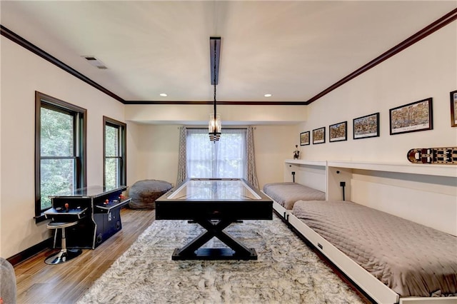10020 Normandy Ln, Suwanee, GA 30024 - rec room featuring crown molding, healthy amount of natural light, wood finished floors, and recessed lighting