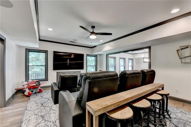 10020 Normandy Ln, Suwanee, GA 30024 - home theater room with a ceiling fan, light wood-style floors, crown molding, and recessed lighting